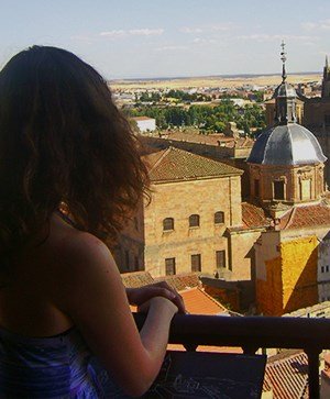Rutgers Global – Study Abroad in Spain, student looking over balcony at Salmanca