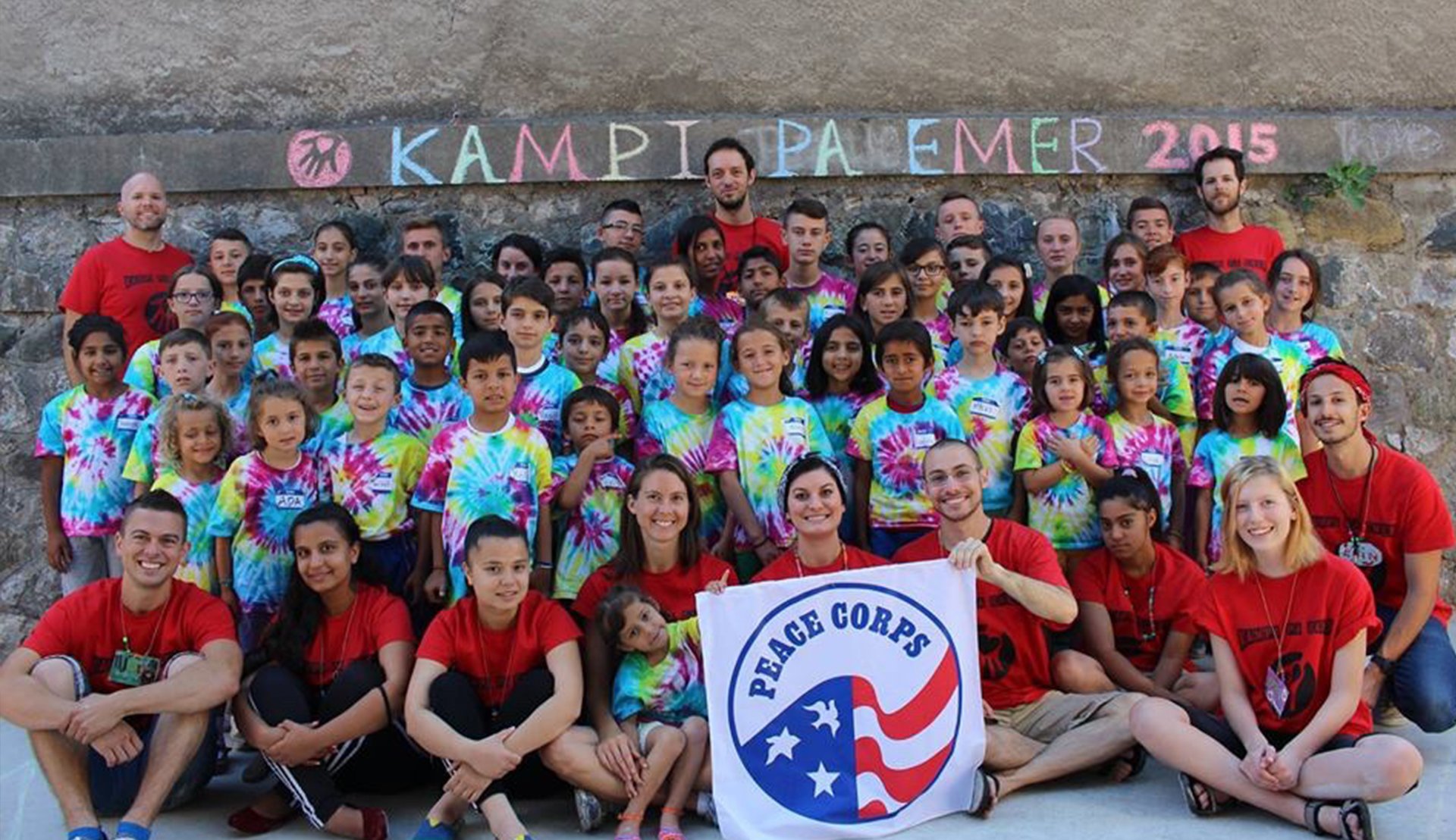 Rutgers Global – Peace Corps Professional Benefits, Jon Breen and other Peace Corps volunteers post with children at a youth center in Albania